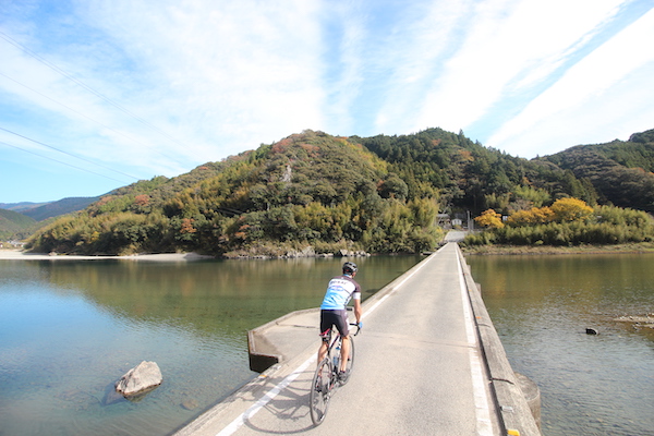 cyclist riding across bridge during great earth kochi